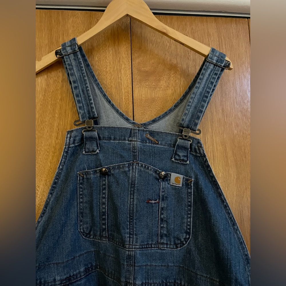Women’s blue denim Carhartt overalls size Large, pockets, full length